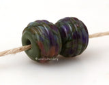 Woody Nightshade Ribbed Pair #2088 A pair of round ribbed lampwork glass bead in olive green with purple, brown, and cream.~~~~~~~~~~~~~~~~~~~~~~~~~~9x12 mm2 Beads2.5 mm hole These lampwork glass beads are ready to ship. Default Title