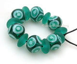 Cabana #545 ~ Transparent teal and mint green dots plus matching matte chunky discs. ~ Size: 12x13 and 6x12 mm Amount: 13 BeadsHole Size: 1.5 mm This handmade bead set is ready to ship. Default Title