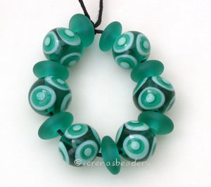 Cabana #545 ~ Transparent teal and mint green dots plus matching matte chunky discs. ~ Size: 12x13 and 6x12 mm Amount: 13 BeadsHole Size: 1.5 mm This handmade bead set is ready to ship. Default Title