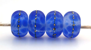 Bodacious Blue #1688 Size: 6x11 mmHole Size: 2.5 mmAmount: 4 beads~ Bold blue beads with fine silver dots. ~ These beads are ready to ship. Default Title