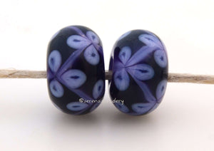 Dark Violet Purple Flowers #1721 Size: 6x12 mm, Amount: 2 Beads, Hole Size: 2.5 mm~ A dark violet and deep purple vine flower pair. Comes in a glossy finish. ~ These beads are ready to ship. Default Title