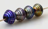 Rainbow Iris Ribbed Bicones #1768 Size: 10x13 mm ~ Amount: 4 Beads ~ Hole Size: 2.5 mm These beads are ready to ship! Default Title