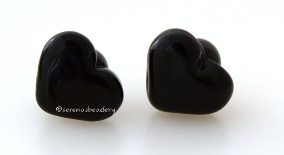 Black Button Pair #1782 Size: 13x11 mm ~ Amount: 2 buttons ~ Hole Size: 2.5 mm~ Two black shank style buttons. Measurements are of the face of the button. ~ This button pair is ready to ship. Default Title