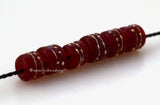 Tiny Tube Red Fine Silver Dots red tube-shaped lampwork glass beads decorated with fine silver dotsThe last picture shows these in my hand for size reference. They are tiny tiny tiny!!~~~~~~~~~~~~~~~~~~~~~~~~~~6x6 mm6 Beads1.5 mm hole Default Title