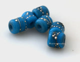 Tiny Tube Turquoise Blue Fine Silver Dots turquoise blue tube-shaped lampwork glass beads decorated with fine silver dotsThe last picture shows these in my hand for size reference. They are tiny tiny tiny!!~~~~~~~~~~~~~~~~~~~~~~~~~~6x6 mm6 Beads1.5 mm hole Default Title