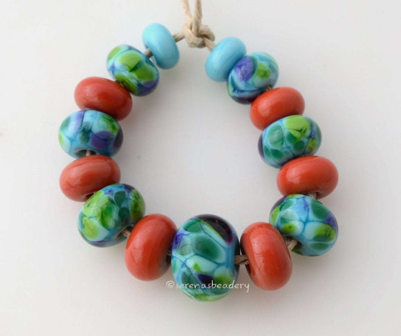 Amazing Graduated Set #1820 Size: 4x8 to 9x13 mm ~ Amount: 15 Beads ~ Hole Size: 2.5 mm~ Turquoise with purple, blue and green plus coral spacers. ~ These beads are ready to ship. Default Title
