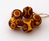 Amber Golden Tribal Rounds #1833 ~ Size: 10x12 mm ~ 5 beads ~ Hole Size: 2.5 mm ~~ 5 unique tribal designs in amber and golden yellow ~ These beads are ready to ship. Default Title