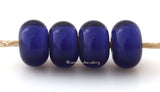 Purple White Heart #1849 6x12 mm4 BeadsHole Size: 2.5 mm ~ Transparent dark purple glass with a white heart or center ~   These handmade lampwork beads are ready to ship. Default Title