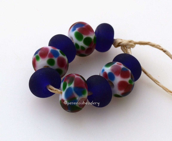 Festive White Matte Set #1857 5x9 to 7x12 mm9 BeadsHole Size: 2.5 mm ~ Bright pink, green and blue in a matte finish with matching cobalt spacers. ~ These lampwork glass beads are ready to ship. Default Title