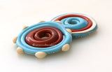 Southwest Disks #1893 Size: 3x28 mmAmount: 2 BeadsHole Size: 2.5 mm Turquoise, ivory, coral and a bit of fine silver in large disks. These disks are ready to ship! Default Title