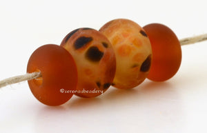 Spotted Tigress #1926 5x10 &amp; 7x12 mm4 BeadsHole Size: 2.5 mm~ pale yellow and amber with spots of deep brown and hints of green and orange plus matching amber spacers in a matte finish ~ These lampwork glass beads are ready to ship. Default Title