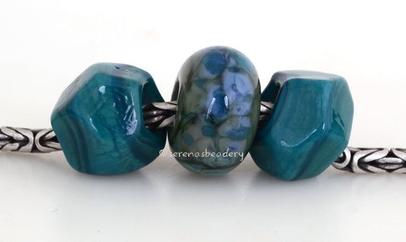 Teal Turn Around #1943 10x14 & 9x15 mm3 BeadsHole Size: 5 mm This lampwork glass bead set is ready to ship. Default Title