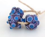 Ziggy Stardust 13x13-15 mm 3 BeadsHole Size: 1.5 mm~ Globular shaped beads in purple and bright turquoise. ~ This lampwork glass bead set is ready to ship. Default Title