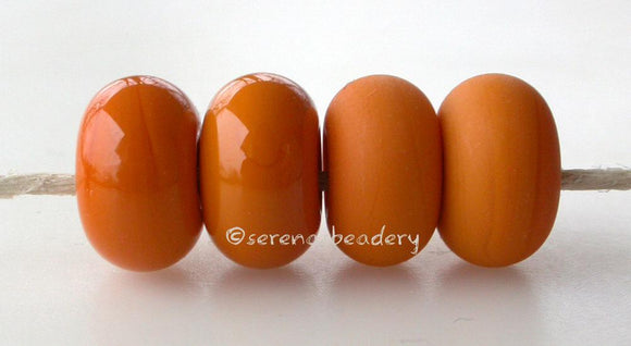 Alley Cat Color Notes: An opaque orange. Available shapes and sizes:Round Bead Shapes: Available to order 8 to 15 mm with hole sizes ranging from 1.5 to 5 mm. See drop down menu for the exact options. Shown here in 8, 9 and 10 mm with both a 2.5 mm and 1.5 mm hole. 4 and 5 mm holes will fit European Charm style jewelry.Also available in a wavy disk or bead cap:. Pressed bead shapes:Lentil - 12x13 mm in size with a 1.5mm hole.: Pillow 13 mm square with a 1.5 mm hole.: Tab: Default Title