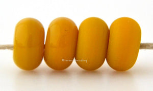 Ocher Limited Edition Color Notes: Available shapes and sizes:Round Bead Shapes: Available to order 8 to 15 mm with hole sizes ranging from 1.5 to 5 mm. See drop down menu for the exact options. Shown here in 8, 9 and 10 mm with both a 2.5 mm and 1.5 mm hole. 4 and 5 mm holes will fit European Charm style jewelry.Also available in a wavy disk or bead cap:. Pressed bead shapes:Lentil - 12x13 mm in size with a 1.5mm hole.: Pillow 13 mm square with a 1.5 mm hole.: Tab: Default Title
