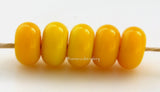 Goldenrod Spacers #1962 5 Goldenrod spacers - 5x10 mm with a 2.5 mm hole, glossy finish. This handmade bead set is ready to ship! Default Title