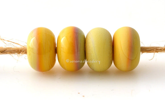 Yellow Brick Road Color Notes: An opaque yellow. Available shapes and sizes:Round Bead Shapes: Available to order 8 to 15 mm with hole sizes ranging from 1.5 to 5 mm. See drop down menu for the exact options. Shown here in 8, 9 and 10 mm with both a 2.5 mm and 1.5 mm hole. 4 and 5 mm holes will fit European Charm style jewelry.Also available in a wavy disk or bead cap:. Pressed bead shapes:Lentil - 12x13 mm in size with a 1.5mm hole.: Pillow 13 mm square with a 1.5 mm hole.: Tab: Default Title