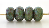 Green Fields Soft green lampwork glass beads with a dusting of pink, blue, and amethyst.Bead Size: 6x11-12 or 7x13-14 mmHole Size: 2.5 mmprice is for one bead with a discount for 4 or more 11-12 mm,Glossy,13-14 mm,Glossy,11-12 mm,Matte,13-14 mm,Matte