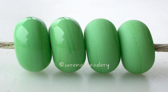 Iguana Color Notes: An opaque green. Available shapes and sizes:Round Bead Shapes: Available to order 8 to 15 mm with hole sizes ranging from 1.5 to 5 mm. See drop down menu for the exact options. Shown here in 8, 9 and 10 mm with both a 2.5 mm and 1.5 mm hole. 4 and 5 mm holes will fit European Charm style jewelry.Also available in a wavy disk or bead cap:. Pressed bead shapes:Lentil - 12x13 mm in size with a 1.5mm hole.: Pillow 13 mm square with a 1.5 mm hole.: Tab: Default Title