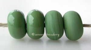 Fiddlehead Color Notes: An opaque green. Available shapes and sizes:Round Bead Shapes: Available to order 8 to 15 mm with hole sizes ranging from 1.5 to 5 mm. See drop down menu for the exact options. Shown here in 8, 9 and 10 mm with both a 2.5 mm and 1.5 mm hole. 4 and 5 mm holes will fit European Charm style jewelry.Also available in a wavy disk or bead cap:. Pressed bead shapes:Lentil - 12x13 mm in size with a 1.5mm hole.: Pillow 13 mm square with a 1.5 mm hole.: Tab: Default Title