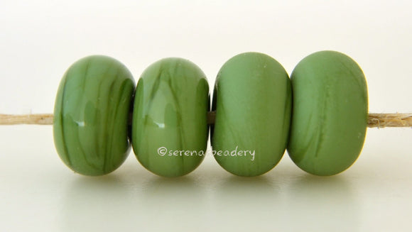 Meadow Color Notes: An opaque green. Available shapes and sizes:Round Bead Shapes: Available to order 8 to 15 mm with hole sizes ranging from 1.5 to 5 mm. See drop down menu for the exact options. Shown here in 8, 9 and 10 mm with both a 2.5 mm and 1.5 mm hole. 4 and 5 mm holes will fit European Charm style jewelry.Also available in a wavy disk or bead cap:. Pressed bead shapes:Lentil - 12x13 mm in size with a 1.5mm hole.: Pillow 13 mm square with a 1.5 mm hole.: Tab: Default Title