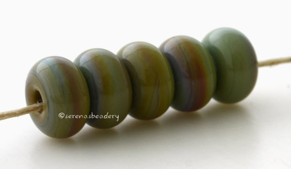 Dragon Spacers #1966 5 Dragon spacers, opaque green with hints of brown - 5x10 mm with a 2.5 mm hole, glossy finish. This handmade bead set is ready to ship! Default Title