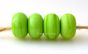 Prairie Grass Color Notes: An opaque yellow-green. Available shapes and sizes:Round Bead Shapes: Available to order 8 to 15 mm with hole sizes ranging from 1.5 to 5 mm. See drop down menu for the exact options. Shown here in 8, 9 and 10 mm with both a 2.5 mm and 1.5 mm hole. 4 and 5 mm holes will fit European Charm style jewelry.Also available in a wavy disk or bead cap:. Pressed bead shapes:Lentil - 12x13 mm in size with a 1.5mm hole.: Pillow 13 mm square with a 1.5 mm hole.: Tab: Default Title