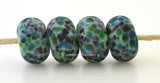 Jitterbug Jitterbug frit beads in purple, blue, green and black.Bead Size: 6x11-12 or 7x13-14 mmHole Size: 2.5 mmprice is for one bead with a discount for 4 or more 11-12 mm,Glossy,13-14 mm,Glossy,11-12 mm,Matte,13-14 mm,Matte
