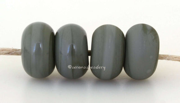 Bayou Color Notes: An opaque gray-green. Available shapes and sizes:Round Bead Shapes: Available to order 8 to 15 mm with hole sizes ranging from 1.5 to 5 mm. See drop down menu for the exact options. Shown here in 8, 9 and 10 mm with both a 2.5 mm and 1.5 mm hole. 4 and 5 mm holes will fit European Charm style jewelry.Also available in a wavy disk or bead cap:. Pressed bead shapes:Lentil - 12x13 mm in size with a 1.5mm hole.: Pillow 13 mm square with a 1.5 mm hole.: Tab: Default Title