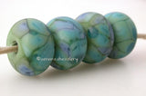 Green Olive Boogie Opaque olive green with blue and turquoise boogie frit.Bead Size: 6x11-12 or 7x13-14 mmHole Size: 2.5 mmprice is for one bead with a discount for 4 or more 11-12 mm,Glossy,13-14 mm,Glossy,11-12 mm,Matte,13-14 mm,Matte