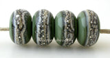 Olive Green Granite with Fine Silver Olive green wrapped in silvered ivory and fine silver droplets. 5x11 mm 2.5 mm hole Price is per bead with discounts for larger quantities. Glossy,Matte