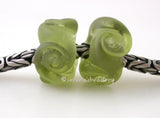 Twisted Mojito Green Tumbled Charm Pair A pair of transparent mojito green twisted glass beads that will fit your European charm style bracelet, although the bracelet is not for sale. I tumble these which give a super soft frosted matte finish while leaving a small shiny glossy crevice in the lower regions of this textured bead. I love this technique as it gives an extra special touch!~~~~~~~~~~~~~~~~~~~~~~~~~~7x15 mm2 Beads5 mm hole Default Title