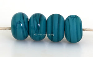 Troi Color Notes: An opaque teal. Available shapes and sizes:Round Bead Shapes: Available to order 8 to 15 mm with hole sizes ranging from 1.5 to 5 mm. See drop down menu for the exact options. Shown here in 8, 9 and 10 mm with both a 2.5 mm and 1.5 mm hole. 4 and 5 mm holes will fit European Charm style jewelry.Also available in a wavy disk or bead cap:. Pressed bead shapes:Lentil - 12x13 mm in size with a 1.5mm hole.: Pillow 13 mm square with a 1.5 mm hole.: Tab: Default Title