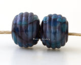Purple Waltz Ribbed Pair #2090 A pair of round ribbed lampwork glass bead in dark purple with violet.~~~~~~~~~~~~~~~~~~~~~~~~~~9x12 mm2 Beads2.5 mm hole These lampwork glass beads are ready to ship. Default Title