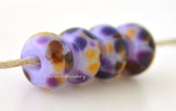 Poised Soft lavender pink lampwork glass beads with deep purple, amethyst, golden yellow and brown.Bead Size: 6x11-12 or 7x13-14 mmHole Size: 2.5 mmprice is for one bead with a discount for 4 or more 11-12 mm,Glossy,13-14 mm,Glossy,11-12 mm,Matte,13-14 mm,Matte