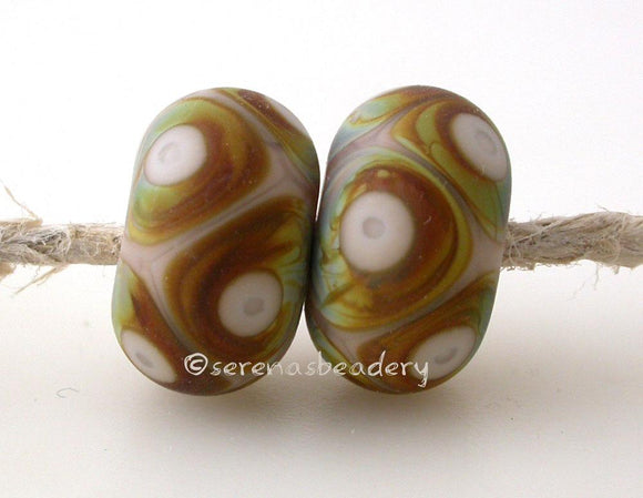 Ginger Raku Dots 6x12 mm Hole Size: 2.5 mm~ ginger and raku brown dot pair in a matte finish ~ This lampwork glass bead pair is ready to ship. Default Title