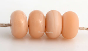 Peaches N Cream Color Notes: An opal peach. Available shapes and sizes:Round Bead Shapes: Available to order 8 to 15 mm with hole sizes ranging from 1.5 to 5 mm. See drop down menu for the exact options. Shown here in 8, 9 and 10 mm with both a 2.5 mm and 1.5 mm hole. 4 and 5 mm holes will fit European Charm style jewelry.Also available in a wavy disk or bead cap:. Pressed bead shapes:Lentil - 12x13 mm in size with a 1.5mm hole.: Pillow 13 mm square with a 1.5 mm hole.: Tab: Default Title