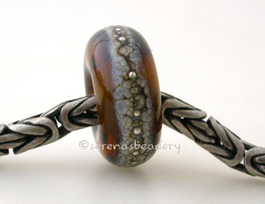 Maple Granite Silver European Charm Maple brown lampwork glass bead with silvered ivory and fine silver droplets with a hole large enough to fit your european charm style bracelet. Can be ordered in either glossy or matte finish.~~~~~~~~~~~~~~~~~~~~~~~~~~6x14 mm1 Bead5 mm hole Glossy,Matte