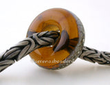 Maple Granite Silver European Charm Maple brown lampwork glass bead with silvered ivory and fine silver droplets with a hole large enough to fit your european charm style bracelet. Can be ordered in either glossy or matte finish.~~~~~~~~~~~~~~~~~~~~~~~~~~6x14 mm1 Bead5 mm hole Glossy,Matte
