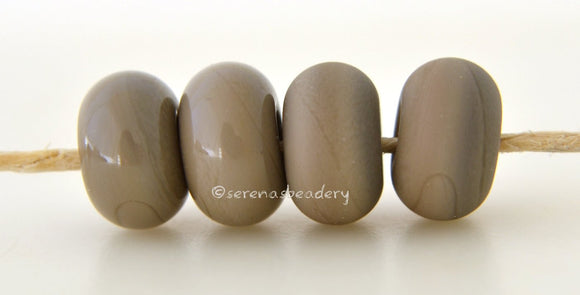 Cobblestone Color Notes: An opaque gray. Available shapes and sizes:Round Bead Shapes: Available to order 8 to 15 mm with hole sizes ranging from 1.5 to 5 mm. See drop down menu for the exact options. Shown here in 8, 9 and 10 mm with both a 2.5 mm and 1.5 mm hole. 4 and 5 mm holes will fit European Charm style jewelry.Also available in a wavy disk or bead cap:. Pressed bead shapes:Lentil - 12x13 mm in size with a 1.5mm hole.: Pillow 13 mm square with a 1.5 mm hole.: Tab: Default Title