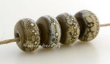 Deep Gray Granite with Fine Silver Deep gray wrapped in silvered ivory and fine silver droplets. 5x11 mm 2.5 mm hole Price is per bead with discounts for larger quantities. Glossy,Matte