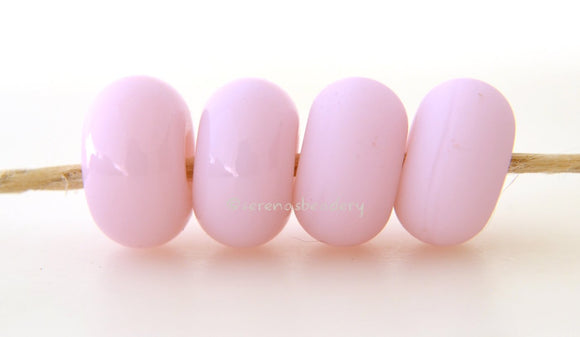 Primrose Color Notes: A pale opaque pink. Available shapes and sizes:Round Bead Shapes: Available to order 8 to 15 mm with hole sizes ranging from 1.5 to 5 mm. See drop down menu for the exact options. Shown here in 8, 9 and 10 mm with both a 2.5 mm and 1.5 mm hole. 4 and 5 mm holes will fit European Charm style jewelry.Also available in a wavy disk or bead cap:. Pressed bead shapes:Lentil - 12x13 mm in size with a 1.5mm hole.: Pillow 13 mm square with a 1.5 mm hole.: Tab: Default Title