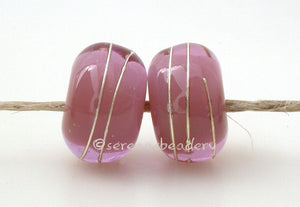 Pink Chai Age Old A layer of pink over chai with a silver wrap.   6x12 mm with a 2.5 mm hole. Price is per bead. Glossy,Matte