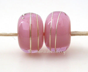 Pink Ginger Age Old A layer of pink over ginger with a silver wrap.   6x12 mm with a 2.5 mm hole. Price is per bead. Glossy,Matte