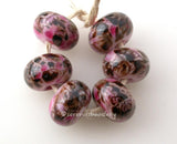 Pink Cherry Blossoms Pink beads covered in cherry blossom colored frit. Normal is shown above, dark is shown to the left.Bead Size: 6x11-12 or 7x13-14 mmHole Size: 2.5 mmprice is for one bead with a discount for 4 or more 11-12 mm,Glossy,13-14 mm,Glossy,11-12 mm,Matte,13-14 mm,Matte