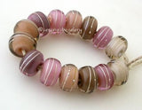 Age Old Set One pair each of 7 shades of pink and grey layers with a silver wrap. 14 beads total   6x12 mm with a 2.5 mm hole. Glossy,Matte