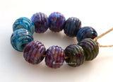 Exquisite Beauty Ribbed Pair #2087 A pair of round ribbed lampwork glass bead in blue with purple and peach.~~~~~~~~~~~~~~~~~~~~~~~~~~9x12 mm2 Beads2.5 mm hole These lampwork beads are ready to ship. Default Title