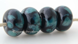 Black Ocean Black lampwork glass beads with tiny turquoise frit.Bead Size: 6x11-12 or 7x13-14 mmHole Size: 2.5 mmprice is for one bead with a discount for 4 or more 11-12 mm,Glossy,13-14 mm,Glossy,11-12 mm,Matte,13-14 mm,Matte