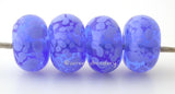 Spotted Blue Periwinkle Transparent blue beads covered in periwinkle blue colored frit. The picture shows them in both glossy and matte.Bead Size: 6x11-12 or 7x13-14 mmHole Size: 2.5 mmprice is for one bead with a discount for 4 or more 11-12 mm,Glossy,13-14 mm,Glossy,11-12 mm,Matte,13-14 mm,Matte
