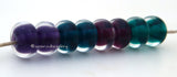 Clearly Color Cleary Color pairs - bold intense shades of purple, steel blue, berry and teal. Each has a bold colored heart or center and is cased in clear. You can order each color separately or the set of 8 beads as shown and in glossy or matte.Bead Size:7x12 mmAmount:1 BeadHole Size:2.5 mm Glossy,Steel Blue,Glossy,Berry Teal,Glossy,Purple,Glossy,Full Set of 4 Pairs,Matte,Steel Blue,Matte,Berry Teal,Matte,Purple,Matte,Full Set of 4 Pairs